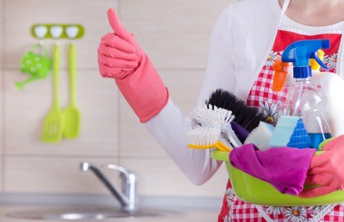 Carpet cleaning worker using protective gear while handling cleaning products